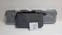Set of three Moda Italia purses lined up, showing all items in the lot