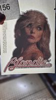 Photo of blond woman iron-on transfer with 'Blondie' text in red script with glitter.