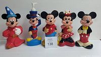 Five Soaky bubble bath bottles shaped as Mickey and Minnie Mouse characters, arranged side by side on a white surface against a white background, showing their front sides clearly.