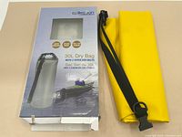 Photo of original retail box displaying 30L dry bag with water resistant, splash proof, roll-top closure features.