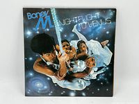 Front cover of the Boney M. LP album "Nightflight to Venus" showing the band members in space-themed costumes.