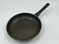 Top view of black non-stick skillet showing interior surface and handle