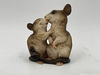 Front view of Italian made signed vintage mice ceramic figurine showing tender pose between two mice.