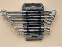 Full set of 10 Mastercraft metric combination wrenches arranged in holder showing varying sizes with chrome finish.