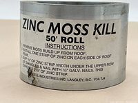 Roll of Zinc Moss Kill showing the label with usage instructions and manufacturer details.