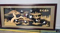 Full view of the large vintage Chinese cork carving display showing cranes and a natural landscape within a dark wooden shadow box frame.