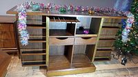Cabinet fully expanded showing side panels, interior shelves, central drawers and built-in bottle rack