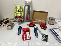 Overall view of all new tools and accessories laid out on tabletop