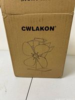 CWLAKON branded cardboard box with printed outline image of the stove fan on front.