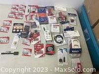 Photo showing the full collection of electrical and plumbing items spread on a white surface