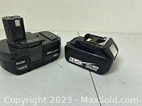 Two Ryobi 18V lithium-ion hand tool batteries on a white surface, one marked 5.0Ah, the other 4.0Ah with model OP405.