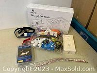 Photo showing the complete lot including the ElsPet Elevated Pet Bowls box, collars, leash, cat toy, and grooming gloves.