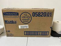 Front view of cardboard box showing product brand, quantity (2 x 300 sheets), size 579.8 sq ft, and item number 05820 01.