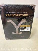 Front view of the Yellowstone limited edition complete series box set unopened in shrink wrap with a label and visible package rip.