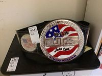 Full view of replica belt laid flat showing main and side plates