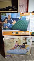 Box of the green Classic Downy full size air mattress by Intex, showing product image, model name, and dimensions.
