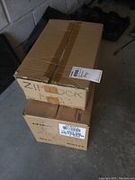 Two stacked cardboard boxes labeled for ziplock bags.