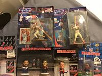 Photo showing 7 boxed sports collectibles from Starting Lineup and Headliners series including baseball, hockey, and NFL figures.