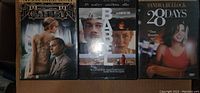 Three DVDs shown: The Great Gatsby, Babe, 28 Days