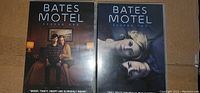Photo showing Bates Motel Season 1 and Season 2 DVD cases side by side