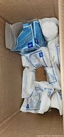 Box containing multiple individually packaged sterile gauze pads and ace-type bandages.