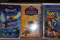 VHS tapes: The Rescuers, The Hunchback of Notre Dame, Toy Story