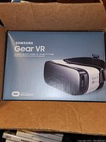 Photo of the Samsung Gear VR headset box inside a cardboard box, showing branding, compatibility, and Oculus logo.