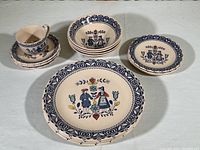 Top-down view of entire Johnson Brothers Hearts and Flowers dinnerware set showing pattern details and variety of pieces.