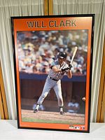 Full view of framed Will Clark San Francisco Giants poster measuring 24x36 inches showing the player in a batting stance with crowd in background.