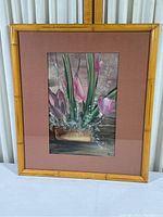 Framed watercolor painting showing the full artwork and faux bamboo frame with signs of wear and scuffing.