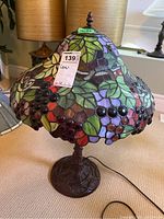 Full view of table lamp showing shade and base