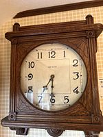 Front view of clock case and dial