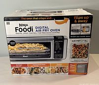 Box showing Ninja Foodi Digital Air Fry Oven branding and features
