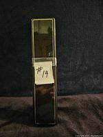 Closed rectangular box with a tag marked '#14' taped on it, likely the original or storage box for the chain.