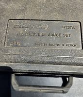 Close-up of Snap-on MT37A oil pressure gauge set label on case lid