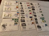 Photo showing a collection of several St. Vincent Official First Day Covers arranged for display, featuring envelopes with various stamps and cancellations.