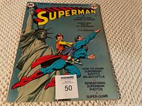 Front cover of the comic book showing Superman flying with a boy in front of the Statue of Liberty, featuring multiple advertised content highlights.