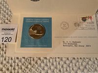 Official United Nations commemorative sterling silver medal in blue holder with First Day Issue stamp and postmarked envelope.