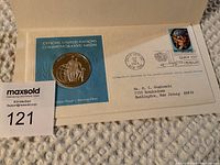Official United Nations commemorative sterling silver medal with accompanying first day issue stamped envelope dated October 18, 1974, showing certification and postal mark.