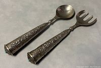 Pair of vintage 11-inch salad serving utensils showing the spoon and fork with detailed etched silver plate handles and turquoise stones.