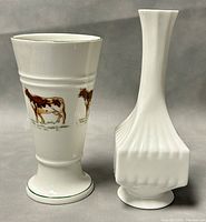 Two porcelain bud vases side by side, showing shape and design distinctions.