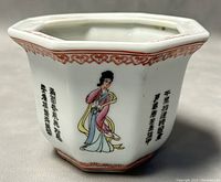 Octagonal flower pot side with hand painted female figure and Chinese calligraphy