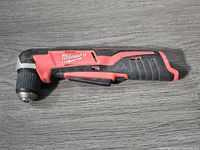 Side profile of Milwaukee M12 cordless right angle drill showing general condition and design.