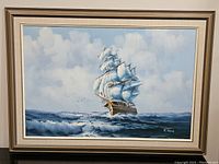 Framed oil painting showing full seascape and clipper ship with signature R. Boren.