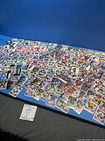 Large spread of 2016-17 Panini NHL hockey stickers displayed on a blue table, showing multiple players and team variations.