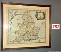 Full view of framed map on wall, showing overall condition and matting