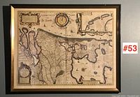 Full view of framed map hanging on wall