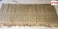 Full view of antique Siam textile laid flat showing overall design and fringe.