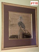 Full front view of framed artwork showing frame, mat, and central image