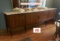 Front view of wood veneer sideboard with marble top and ormolu mounts